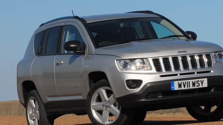 2011 Jeep Compass UK Headlights On in Silver Front Pose